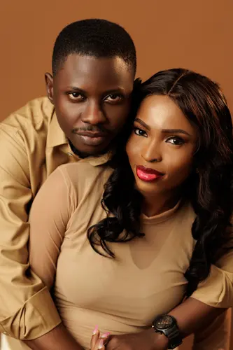 Opeyemi and Mayowa in champagne-coloured outfits