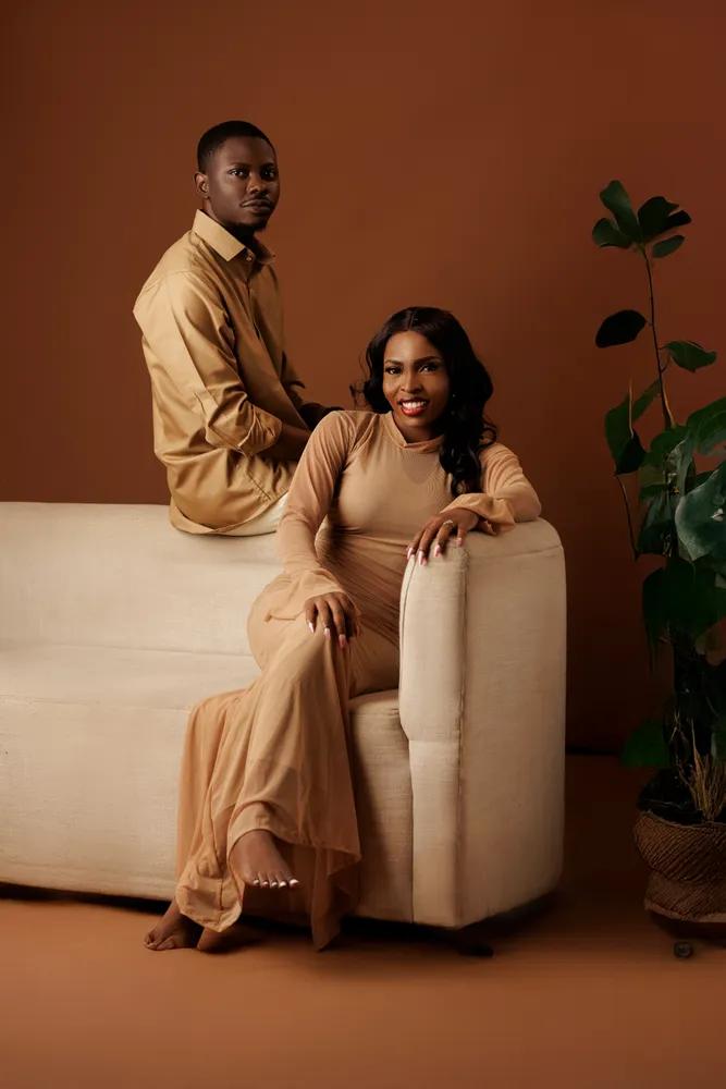 Opeyemi and Mayowa in champagne-coloured outfits