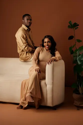 Opeyemi and Mayowa in champagne-coloured outfits