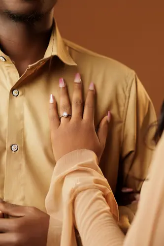 Opeyemi and Mayowa in champagne-coloured outfits
